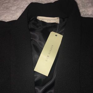 Sophie Rue sleeveless black cape blazer.